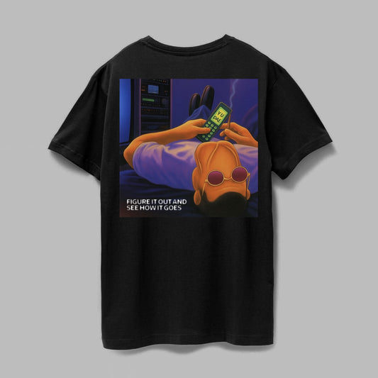 Black t-shirt with a graphic design on the back featuring a person using a phone and text 'Figure it out and see how it goes'.