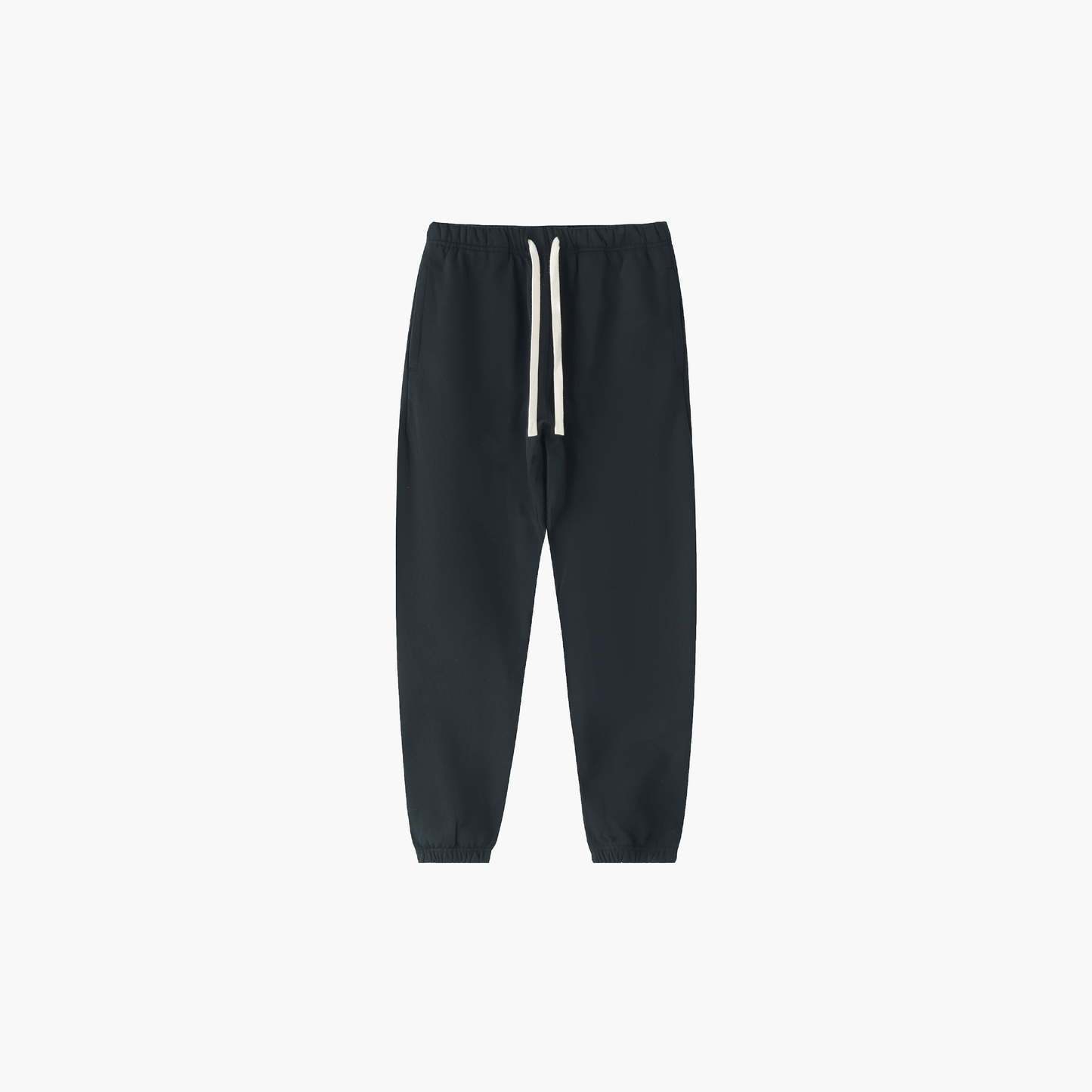 Black sweatpants with white drawstrings on a light gray background