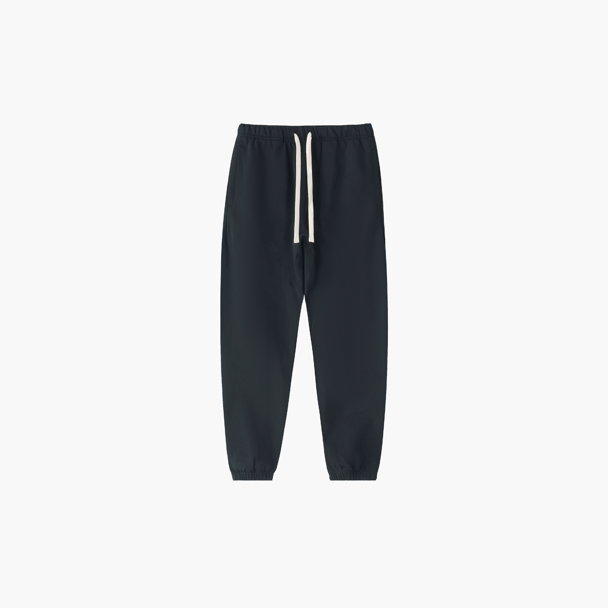 Black sweatpants with white drawstrings on a light gray background