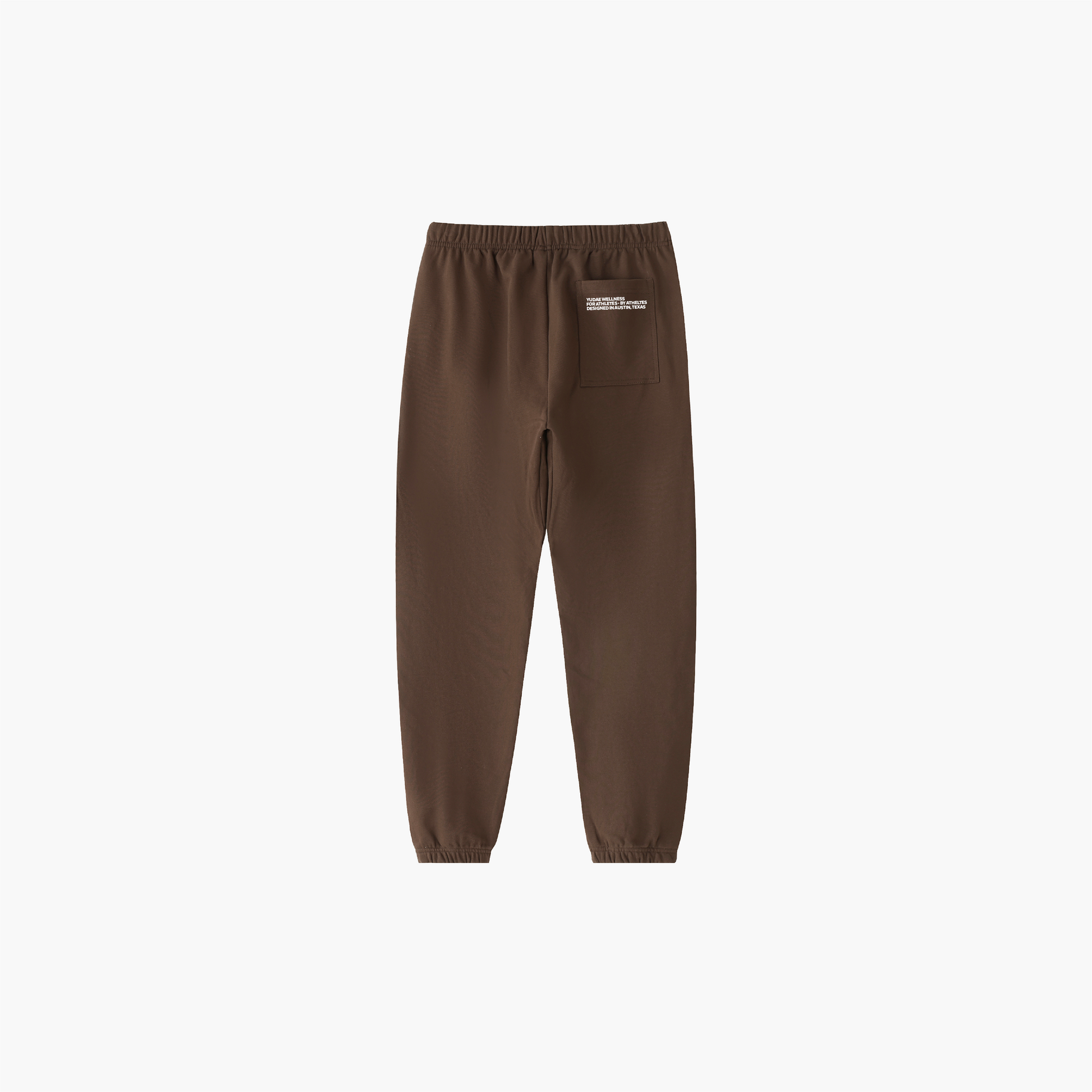 Brown sweatpants with a small logo on a white background